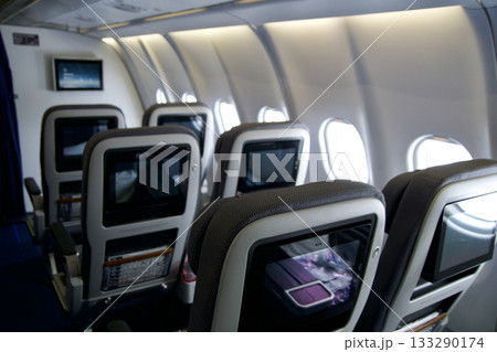 Frankfurt, Germany, June 10, 2019: Premium Economy Cabin with Multiple Seat Rows on a Long Haul Aircraft 133290174