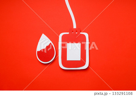Blood bag and blood droplet on red background 133291108