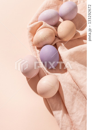 Easter background with colorful pastel eggs on linen napkin Easter background with colorful pastel eggs on linen napkin 133292672