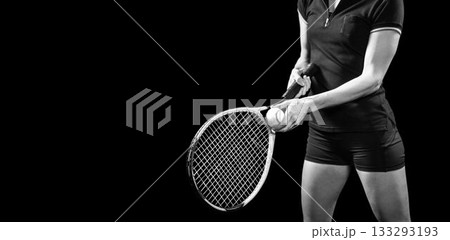 Midsection of woman holding tennis racket and ball 133293193