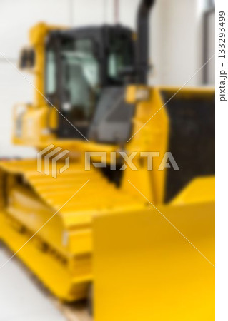 Close-up of earth mover parked at factory Close-up of earth mover parked at factory 133293499