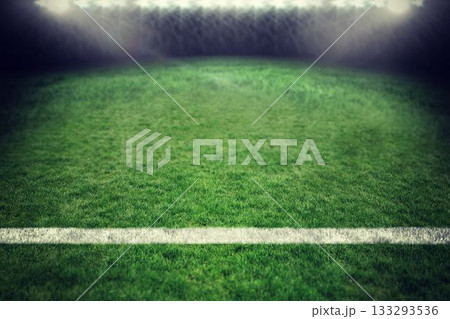 Flat design grass pitch is glowing under floodlights at night, with white boundary line and mist Flat design grass pitch is glowing under floodlights at night, with white boundary line and mist 133293536