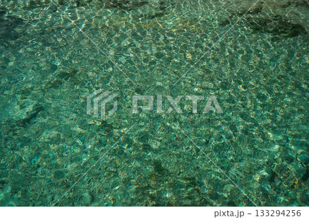 Clear turquoise blue lake, top view. 133294256