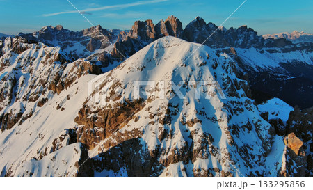 Rocky snow mountains at sunrise aerial Rocky snow mountains at sunrise aerial 133295856