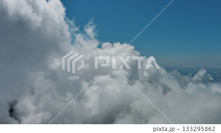 Flying through white fluffy clouds Flying through white fluffy clouds 133295862
