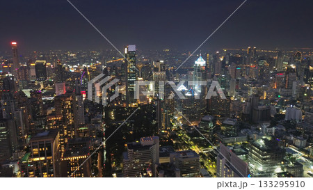 Illuminated skyscrapers and Lumpini park in Bangkok Illuminated skyscrapers and Lumpini park in Bangkok 133295910