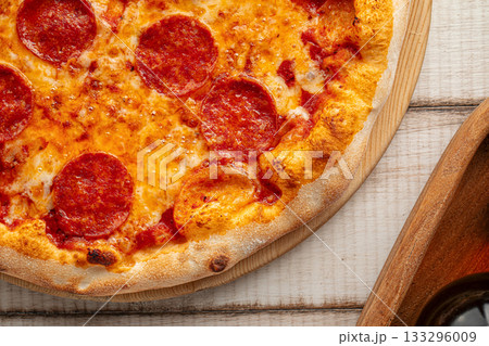 Pepperoni pizza with melted cheese 133296009