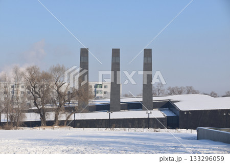 Three large, black Chimneys above the Unit 731 memorial in Harbin, China 133296059