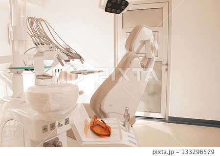 Modern dental clinic interior with equipment and patient chair ready for treatment 133296579