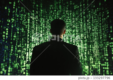 A man in a suit stands in front of a green screen with a lot of numbers A man in a suit stands in front of a green screen with a lot of numbers 133297796