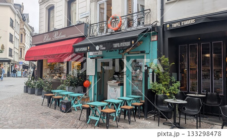 Seafood restaurant's small tables and chairs on the street at the touristic area in Antwerp Seafood restaurant's small tables and chairs on the street at the touristic area in Antwerp 133298478