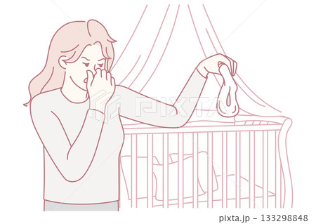 Unhappy mother holding stinky diaper Unhappy mother holding stinky diaper 133298848