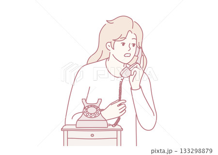 Young woman talk on landline phone Young woman talk on landline phone 133298879