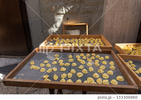 Handmade orecchiette pasta at a street market in Bari, Italy. 133300860