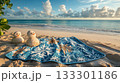 Christmas-themed beach towels, sand snowmen, ocean view . 133301186