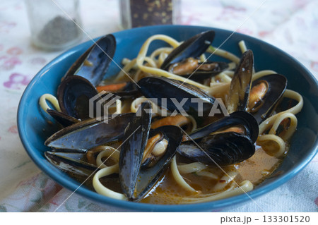 pasta with mussels in blue bowl traditional italian seafood dish 133301520