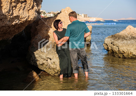 Mature couple in love on the beach in casual clothes 133301664