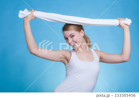 Woman with a towel above her head 133305456