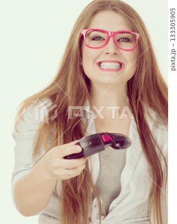 Gamer woman holding gaming pad Gamer woman holding gaming pad 133305905