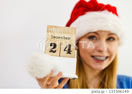 Happy woman holding 24 december date 133306149