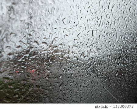 car glass covered in drops 133306373