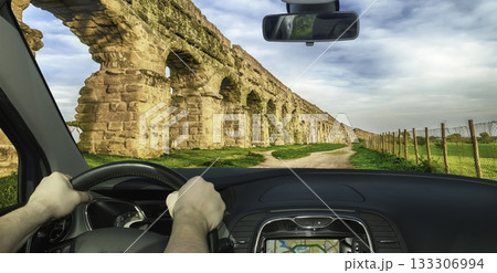 Driving past the ancient Roman Aqueduct Park in Italy Driving past the ancient Roman Aqueduct Park in Italy 133306994