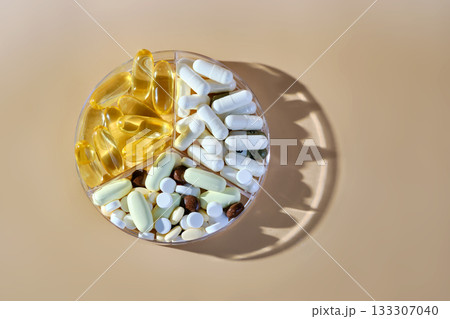Vitamins and supplements in round pill box Vitamins and supplements in round pill box 133307040