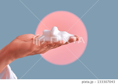 Hand holding soap foam for skincare cleansing Hand holding soap foam for skincare cleansing 133307043
