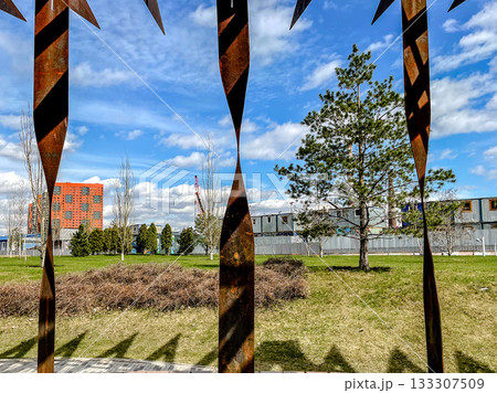 artistic portrayal showcasing stark differences between historic metals and thriving outdoor life artistic portrayal showcasing stark differences between historic metals and thriving outdoor life 133307509