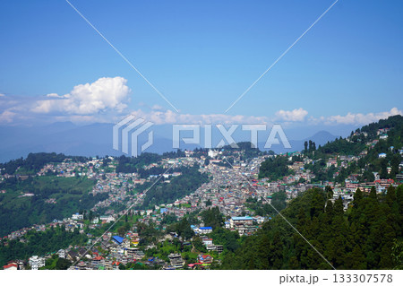 Panoramic View of the Crowded Hill Station Town of Darjeeling with Himalayan Peaks 133307578