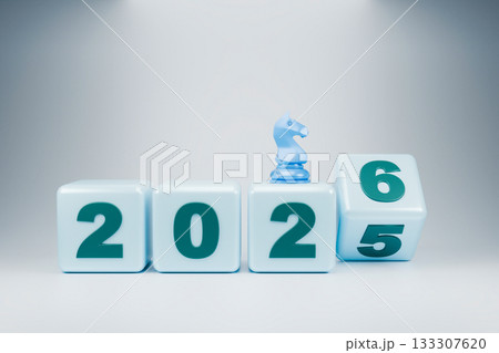 The wooden blocks display the year 2025-2026, with a small chess piece The wooden blocks display the year 2025-2026, with a small chess piece 133307620