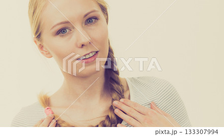 Blonde girl with long braid hair Blonde girl with long braid hair 133307994