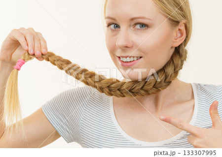 Blonde young woman with braid hair Blonde young woman with braid hair 133307995