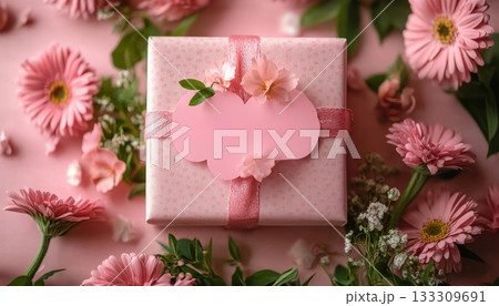 Elegant pink gift box with ribbon and rose decor surrounded by petals on a teal background. Great for birthdays, weddings or Valentine's. Elegant pink gift box with ribbon and rose decor surrounded by petals on a teal background. Great for birthdays, weddings or Valentine's. 133309691