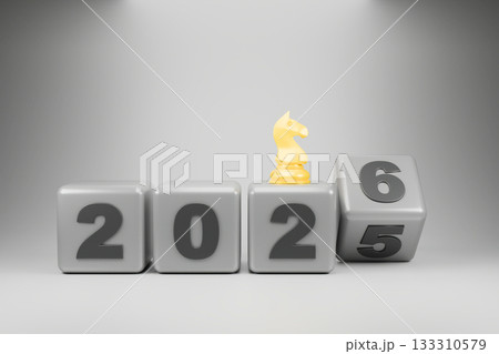 The wooden blocks display the year 2025-2026, with a small chess piece . 133310579