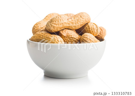 Peanuts in shell. Groundnuts in bowl isolated on white background. 133310783