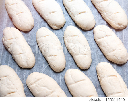 Baked goods, homemade bread dough before baking. 133311640
