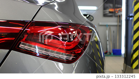 Glare from lights on the body and taillight of a car in a specially lit garage Glare from lights on the body and taillight of a car in a specially lit garage 133312245