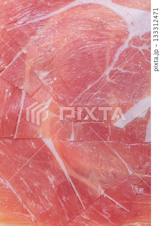 Thinly sliced ham meat macro photo as background. 133312471