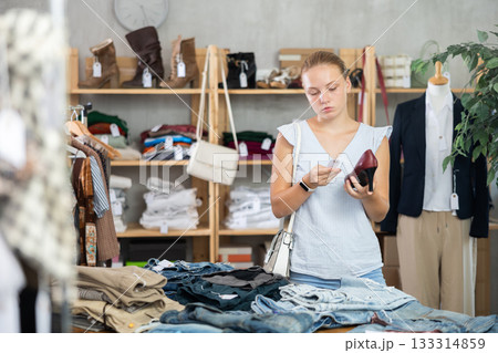 Woman choosing shoes in the store 133314859