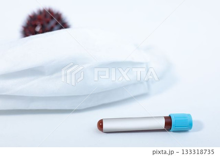 Blood sample test tube, face mask and Covid-19 cell Blood sample test tube, face mask and Covid-19 cell 133318735