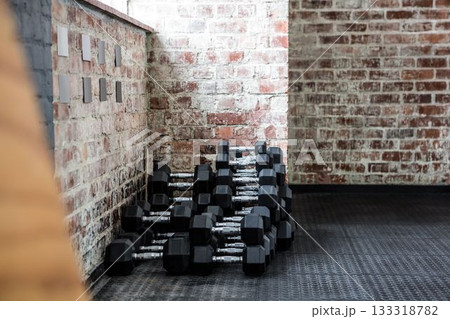 Focus of dumbbells in fitness studio 133318782