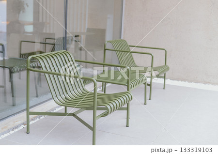 Modern Minimalist Interior with Contrasting White Walls and Green Chairs Modern Minimalist Interior with Contrasting White Walls and Green Chairs 133319103