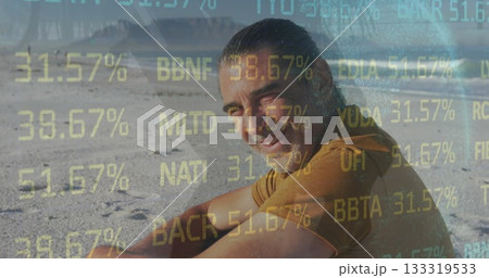 Smiling man in orange T-shirt looking back on desert sand, with alphanumeric overlay, copy space Smiling man in orange T-shirt looking back on desert sand, with alphanumeric overlay, copy space 133319533