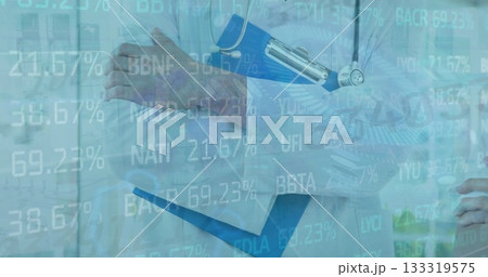 Female doctor in lab coat holding clipboard and stethoscope in clinic, displaying data overlay 133319575