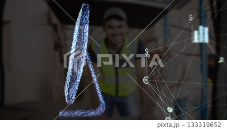 Smiling worker wearing safety vest and cap viewing hologram at warehouse, with currency network 133319652