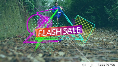 Running man wearing blue sportswear moving along park walkway, with neon FLASH SALE overlay 133319750