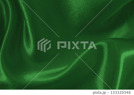 Dark green fabric cloth texture for background and design art work, beautiful crumpled pattern of silk or linen. 133320348