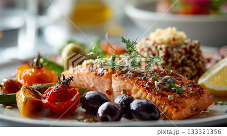 delicious plate of grilled salmon garnished with herbs, accompanied by roasted vegetables, olives, and quinoa salad, creating vibrant and appetizing meal delicious plate of grilled salmon garnished with herbs, accompanied by roasted vegetables, olives, and quinoa salad, creating vibrant and appetizing meal 133321356