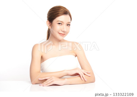 A beautiful young Asian woman with clean, fresh skin against a white background. Skincare, facial treatment, cosmetology, beauty, and spa. An elegant portrait of an Asian woman. A beautiful young Asian woman with clean, fresh skin against a white background. Skincare, facial treatment, cosmetology, beauty, and spa. An elegant portrait of an Asian woman. 133322109